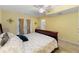 Bedroom featuring a ceiling fan, double doors to the outside, and ensuite bathroom at 4710 Misty Lake Ne Ct, Kennesaw, GA 30144
