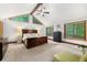 Bright bedroom with large windows, ceiling fan, and vaulted ceilings at 4710 Misty Lake Ne Ct, Kennesaw, GA 30144