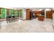 Bright dining area with large windows overlooking wooded backyard and tiled floors at 4710 Misty Lake Ne Ct, Kennesaw, GA 30144