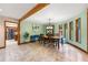 Inviting dining room with large windows, elegant lighting, and view of the kitchen at 4710 Misty Lake Ne Ct, Kennesaw, GA 30144
