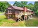 Back of house showing large deck, screened porch, and walkout basement at 4710 Misty Lake Ne Ct, Kennesaw, GA 30144