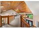 Open hallway with wood-paneled ceilings and view of the front door and chandelier at 4710 Misty Lake Ne Ct, Kennesaw, GA 30144