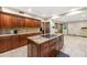 A gourmet kitchen offering expansive granite counters and an open floorplan at 4710 Misty Lake Ne Ct, Kennesaw, GA 30144