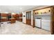 Spacious kitchen with custom cabinets, a center island, and convenient laundry nook at 4710 Misty Lake Ne Ct, Kennesaw, GA 30144