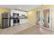 Modern kitchen with stainless steel appliances, white cabinets and access to the yard at 4710 Misty Lake Ne Ct, Kennesaw, GA 30144