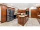 A modern kitchen with stainless steel appliances, granite countertops, and center island at 4710 Misty Lake Ne Ct, Kennesaw, GA 30144