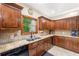 A stunning kitchen with granite counters and abundant cherry-stained cabinetry at 4710 Misty Lake Ne Ct, Kennesaw, GA 30144