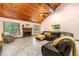 Inviting living room featuring a cozy fireplace and vaulted wood ceilings at 4710 Misty Lake Ne Ct, Kennesaw, GA 30144