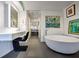 This bathroom features a floating vanity, soaking tub, and recessed lighting at 75 14Th St Ne # 4140, Atlanta, GA 30309