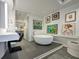This bathroom boasts a floating vanity, soaking tub, and recessed lighting at 75 14Th St Ne # 4140, Atlanta, GA 30309