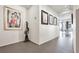 Hallway showcasing modern artwork, a sculpture, and tile flooring leading to other areas at 75 14Th St Ne # 4140, Atlanta, GA 30309