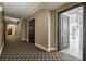 Well-lit hallway with patterned carpeting and dark doors leading to individual units or rooms at 75 14Th St Ne # 4140, Atlanta, GA 30309