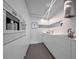 Modern kitchen with sleek white cabinetry, stainless steel appliances, and minimalist design at 75 14Th St Ne # 4140, Atlanta, GA 30309