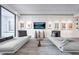 Stylish living room featuring elegant chaise lounges, modern décor, and a wall-mounted television display at 75 14Th St Ne # 4140, Atlanta, GA 30309