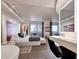 This primary suite features floor-to-ceiling windows, city views and modern ensuite bath at 75 14Th St Ne # 4140, Atlanta, GA 30309