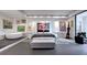 Spacious main room with a modern soaking tub, bed, and a large art display at 75 14Th St Ne # 4140, Atlanta, GA 30309