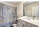 Bright bathroom featuring a tub with shower, neutral color palette, and a vanity at 1005 Belfry Ter, Fairburn, GA 30213