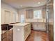 Well-appointed kitchen featuring a central island, stainless steel appliances, and stylish bar seating at 1005 Belfry Ter, Fairburn, GA 30213