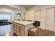 Open kitchen design featuring an island with bar seating that connects to the living room at 1005 Belfry Ter, Fairburn, GA 30213