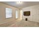 Spacious living room with a large window and tv, creating a welcoming atmosphere at 1005 Belfry Ter, Fairburn, GA 30213