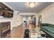 Open floor plan showcasing the living room, with hardwood floors and view into the kitchen at 1005 Belfry Ter, Fairburn, GA 30213