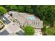 Beautiful aerial view of community clubhouse and large outdoor pool area at 1211 Riverscall Ln, Atlanta, GA 30339