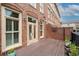 Enjoy indoor outdoor living on this deck with neutral colors and brick accent wall at 1211 Riverscall Ln, Atlanta, GA 30339
