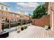 Relax on the lovely deck with brick accent wall and enjoy peaceful views of the surrounding community at 1211 Riverscall Ln, Atlanta, GA 30339