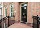 Inviting front entrance with brick facade, black railings, and a classic black door at 1211 Riverscall Ln, Atlanta, GA 30339