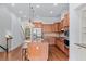 Spacious kitchen featuring an island and stainless steel appliances that opens to the entry and staircase at 1211 Riverscall Ln, Atlanta, GA 30339
