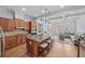 Open-concept kitchen with island, stainless steel appliances, and seamless flow to living area at 1211 Riverscall Ln, Atlanta, GA 30339