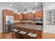 Well-equipped kitchen featuring a center island, wood cabinets, and stainless steel appliances at 1211 Riverscall Ln, Atlanta, GA 30339