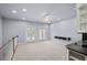 Spacious room with carpet, wet bar, and double doors leading to the outside at 1211 Riverscall Ln, Atlanta, GA 30339