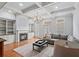 Cozy living room featuring a fireplace, built-in shelving, and comfortable seating arrangement at 1211 Riverscall Ln, Atlanta, GA 30339