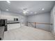 Living room with carpet, wet bar, and stairs leading to the lower level at 1211 Riverscall Ln, Atlanta, GA 30339