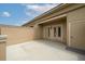 Private patio featuring white walls, French doors and neutral-colored concrete at 1211 Riverscall Ln, Atlanta, GA 30339