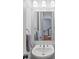 Powder room with stylish fixtures, modern vanity, and decorative mirror at 1211 Riverscall Ln, Atlanta, GA 30339