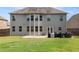 Spacious backyard with a large patio, perfect for entertaining with its lush green lawn at 4815 Edgemoore Trce, Cumming, GA 30040