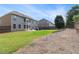 Spacious backyard features a patio, fenced perimeter, and ample green space at 4815 Edgemoore Trce, Cumming, GA 30040