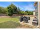 Private backyard with multiple grills on a patio and a wood fence at 4815 Edgemoore Trce, Cumming, GA 30040