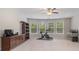 Large bonus room with lots of natural light from multiple windows, as well as neutral colored walls at 4815 Edgemoore Trce, Cumming, GA 30040