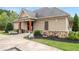 Charming clubhouse featuring stone accents, manicured landscaping, and easy access to the community pool at 4815 Edgemoore Trce, Cumming, GA 30040