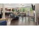 Spacious living room featuring hardwood floors, large windows, and comfortable seating arrangements at 4815 Edgemoore Trce, Cumming, GA 30040