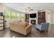 Cozy living room showcases a fireplace, built-in shelving, and comfortable seating at 4815 Edgemoore Trce, Cumming, GA 30040