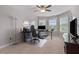 Comfortable home office features a ceiling fan, natural light and ergonomic chair at 4815 Edgemoore Trce, Cumming, GA 30040