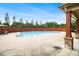 Community swimming pool features a large deck, lounge chairs, and a decorative fence at 4815 Edgemoore Trce, Cumming, GA 30040