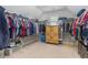 Spacious walk-in closet offers ample storage for clothes, shoes and accessories at 4815 Edgemoore Trce, Cumming, GA 30040