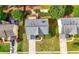 Aerial view of the house showing its well-manicured lawn, patio, and proximity to neighboring homes at 5312 Tormeal Trce, Suwanee, GA 30024