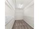 Walk-in closet features ample shelving for clothing, accessories, and storage at 5312 Tormeal Trce, Suwanee, GA 30024