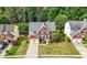 Stunning two-story red brick home featuring a lush front yard and an attached two-car garage at 5312 Tormeal Trce, Suwanee, GA 30024